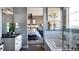 Bathroom with a tub, shower and neutral finishes with a view to an adjacent bedroom at 3867 Freestone Pt, Castle Rock, CO 80108
