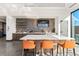 Stylish coffee bar with seating, built-in counter, floating shelves, and modern appliances at 3867 Freestone Pt, Castle Rock, CO 80108
