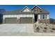 Charming two-story home featuring a three-car garage and manicured landscaping at 3867 Freestone Pt, Castle Rock, CO 80108