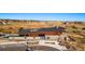 Exterior of community clubhouse with modern design, parking spaces, and landscaping at 3867 Freestone Pt, Castle Rock, CO 80108