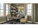 Inviting home office with a rustic table, chairs and ample natural light, perfect for remote work or study at 3867 Freestone Pt, Castle Rock, CO 80108
