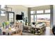 Spacious living room with great view, modern furniture, dining table, and stylish decor accents at 3867 Freestone Pt, Castle Rock, CO 80108