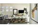 Bright living room with large windows, comfortable seating, and modern decor at 3867 Freestone Pt, Castle Rock, CO 80108