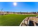Community park featuring artificial turf, playground, a bench and landscaping at 3867 Freestone Pt, Castle Rock, CO 80108