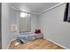 Cozy basement bedroom with a bed and wood-look floor at 1281 Myrtle St, Brighton, CO 80601