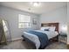 Comfortable bedroom features a queen bed, large mirror, and ample natural light, creating a relaxing space at 3228 W Girard Ave # C, Englewood, CO 80110