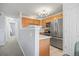 Well-maintained kitchen featuring stainless steel appliances, white countertops, and natural wood cabinets at 3228 W Girard Ave # C, Englewood, CO 80110