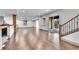 Spacious finished basement with wood floors and access to outdoor patio at 8179 S Kellerman Cir, Aurora, CO 80016