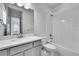Clean, well-maintained bathroom with white tiled shower and modern vanity at 8179 S Kellerman Cir, Aurora, CO 80016