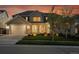 Inviting two-story home featuring a well-manicured lawn and a two-car garage at 8179 S Kellerman Cir, Aurora, CO 80016