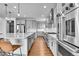 Spacious kitchen features stainless steel appliances, island, and sleek gray cabinetry at 8179 S Kellerman Cir, Aurora, CO 80016