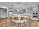 Modern kitchen features large, circular island with seating and stainless steel appliances at 8179 S Kellerman Cir, Aurora, CO 80016