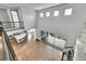 Open-concept living area showcasing high ceilings, hardwood floors, and seamless indoor-outdoor flow at 8179 S Kellerman Cir, Aurora, CO 80016
