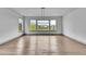 Sun-filled dining room with three large picture windows offering backyard views at 8179 S Kellerman Cir, Aurora, CO 80016