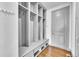 Functional mudroom equipped with built-in storage, bench seating, and durable flooring at 8179 S Kellerman Cir, Aurora, CO 80016