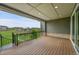 A covered back patio features recessed lighting and overlooks the backyard and the surrounding neighborhood at 8179 S Kellerman Cir, Aurora, CO 80016