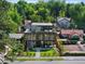 Beautiful aerial view of a modern home surrounded by lush trees and manicured landscaping at 580 S Franklin St, Denver, CO 80209