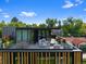 Luxury rooftop terrace with outdoor dining, lounge area, fire pit, and panoramic neighborhood views at 580 S Franklin St, Denver, CO 80209