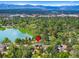 Aerial view of the property, showcasing its location near a lake and mountains at 580 S Franklin St, Denver, CO 80209