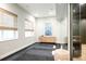 Bright exercise room with yoga mats and large mirror at 580 S Franklin St, Denver, CO 80209