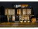 Striking modern home exterior featuring unique architectural details and beautiful nighttime curb appeal at 580 S Franklin St, Denver, CO 80209