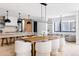 Open-concept living area with a dining area, marble island, and contemporary design elements at 580 S Franklin St, Denver, CO 80209