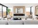 Bright living room with floor-to-ceiling windows, modern fireplace, and stylish furnishings at 580 S Franklin St, Denver, CO 80209