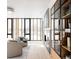 Bright living room with large windows, a modern fireplace, and a bookshelf in the corner at 580 S Franklin St, Denver, CO 80209