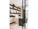 Home office with glass doors, modern furniture, and built-in shelving at 580 S Franklin St, Denver, CO 80209