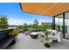 Relaxing outdoor terrace with comfortable seating, a fire pit, and views of the surrounding park and lake at 580 S Franklin St, Denver, CO 80209