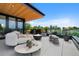 Spacious rooftop deck features a fire pit and comfortable seating at 580 S Franklin St, Denver, CO 80209