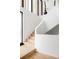 Bright and airy staircase featuring modern design elements and natural wood accents at 580 S Franklin St, Denver, CO 80209