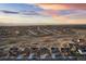 Panoramic aerial showcasing a meticulously planned community against a backdrop of mountains and colorful sky at 8751 S Wenatchee Ct, Aurora, CO 80016