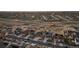An aerial view of a sprawling suburban community at twilight with well-maintained homes and green spaces at 8751 S Wenatchee Ct, Aurora, CO 80016