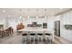 Contemporary kitchen featuring white cabinets, stainless steel appliances, and an island with seating for four at 8751 S Wenatchee Ct, Aurora, CO 80016