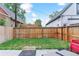 Backyard featuring a wooden fence and a small grassy area, perfect for outdoor activities at 2280 W 42Nd Ave, Denver, CO 80211