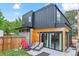 A contemporary home featuring a modern exterior and a backyard with a lounge area at 2280 W 42Nd Ave, Denver, CO 80211