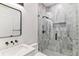 Modern bathroom featuring a glass shower with gray marble and sleek fixtures at 2280 W 42Nd Ave, Denver, CO 80211