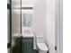 Modern powder room with a floating vanity, gold accents, and decorative mirror at 2280 W 42Nd Ave, Denver, CO 80211
