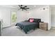 Bright bedroom with a ceiling fan, modern nightstand, and walkout balcony access at 2280 W 42Nd Ave, Denver, CO 80211