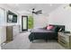 Bright bedroom with a ceiling fan, modern dresser, and walkout balcony access at 2280 W 42Nd Ave, Denver, CO 80211