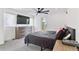 Bright bedroom with a ceiling fan, modern dresser, and walkout balcony access at 2280 W 42Nd Ave, Denver, CO 80211