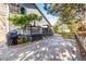 Landscaped backyard with a patio, stone walkway and mature trees at 8762 Mourning Dove Ln, Highlands Ranch, CO 80126