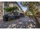 Landscaped backyard with a patio, stone walkway and mature trees at 8762 Mourning Dove Ln, Highlands Ranch, CO 80126