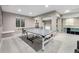 Spacious basement with ping pong table, bar area, and room for recreation and entertainment at 8762 Mourning Dove Ln, Highlands Ranch, CO 80126