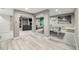 Finished basement area with ping pong table, living area, and attractive flooring at 8762 Mourning Dove Ln, Highlands Ranch, CO 80126
