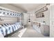 Bright bedroom features a bunk bed with integrated shelving and natural light at 8762 Mourning Dove Ln, Highlands Ranch, CO 80126