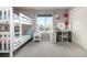 Bright bedroom featuring bunk beds, stylish decor, and a vanity with excellent natural light at 8762 Mourning Dove Ln, Highlands Ranch, CO 80126
