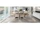 Dining area connecting the living space to an outdoor area with a well-lit, open layout at 8762 Mourning Dove Ln, Highlands Ranch, CO 80126