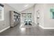 Bright dining area with modern decor, a large storage cabinet, and hardwood flooring at 8762 Mourning Dove Ln, Highlands Ranch, CO 80126